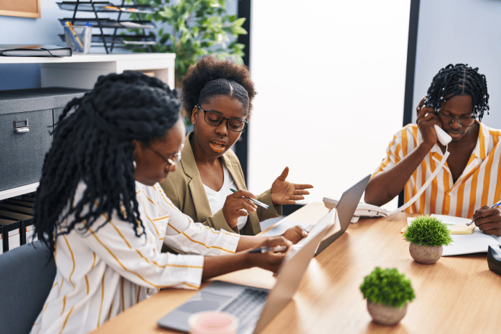 Workers collaborating at table